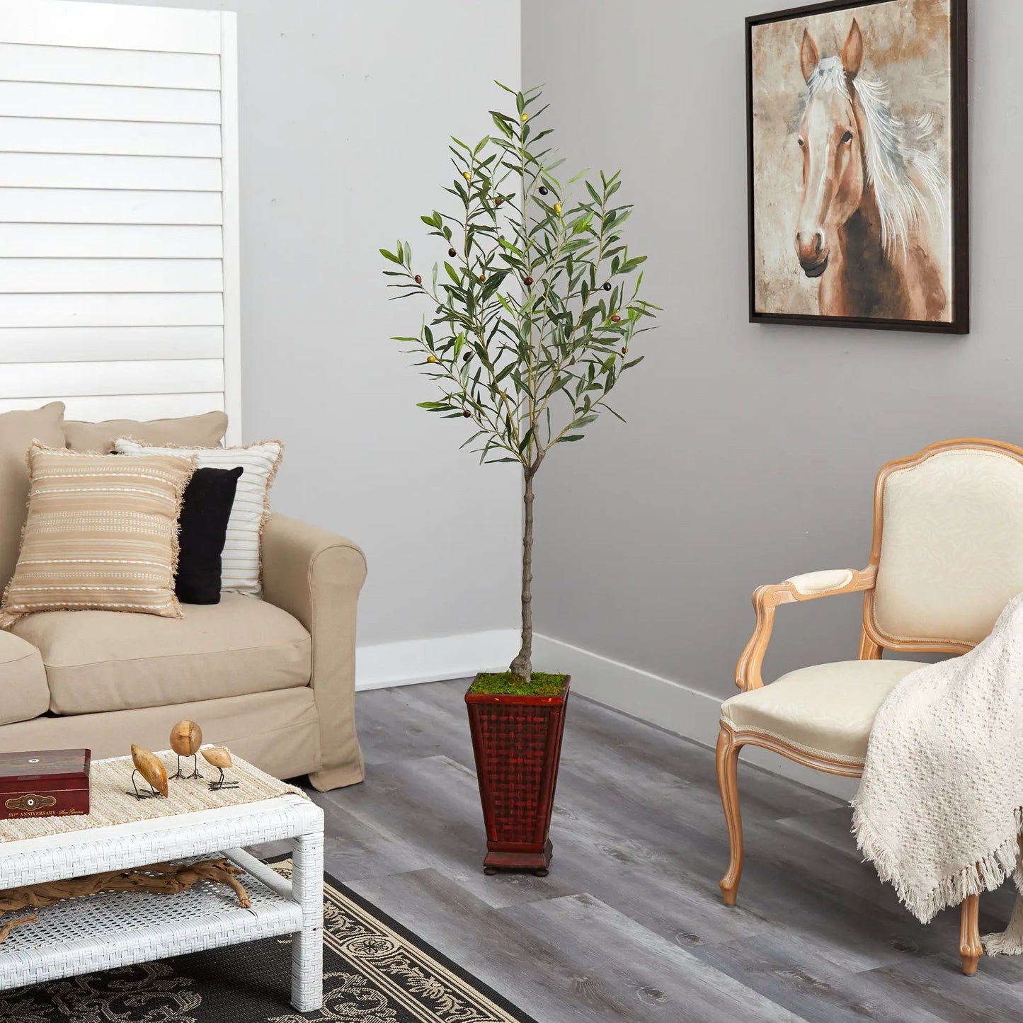Olive artificial tree in decorative red planter with moss top in a living room on Tampa Home & Garden Store