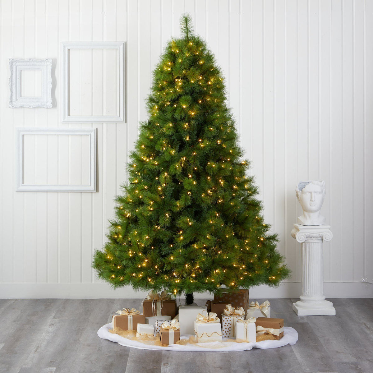7.5ft green Scotch Pine artificial Christmas tree with 550 LED lights around wrapped gifts on Tampa Home & Garden Store