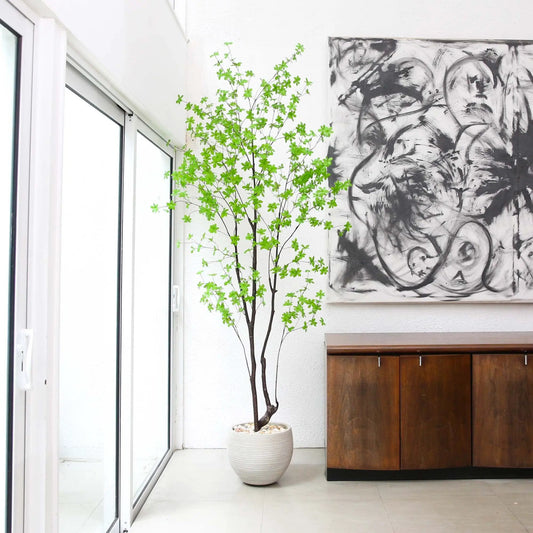 8 ft artificial Enkianthus tree by Nearly Natural in a white ribbed pot with bright green leaves indoors on Tampa Home & Garden Store