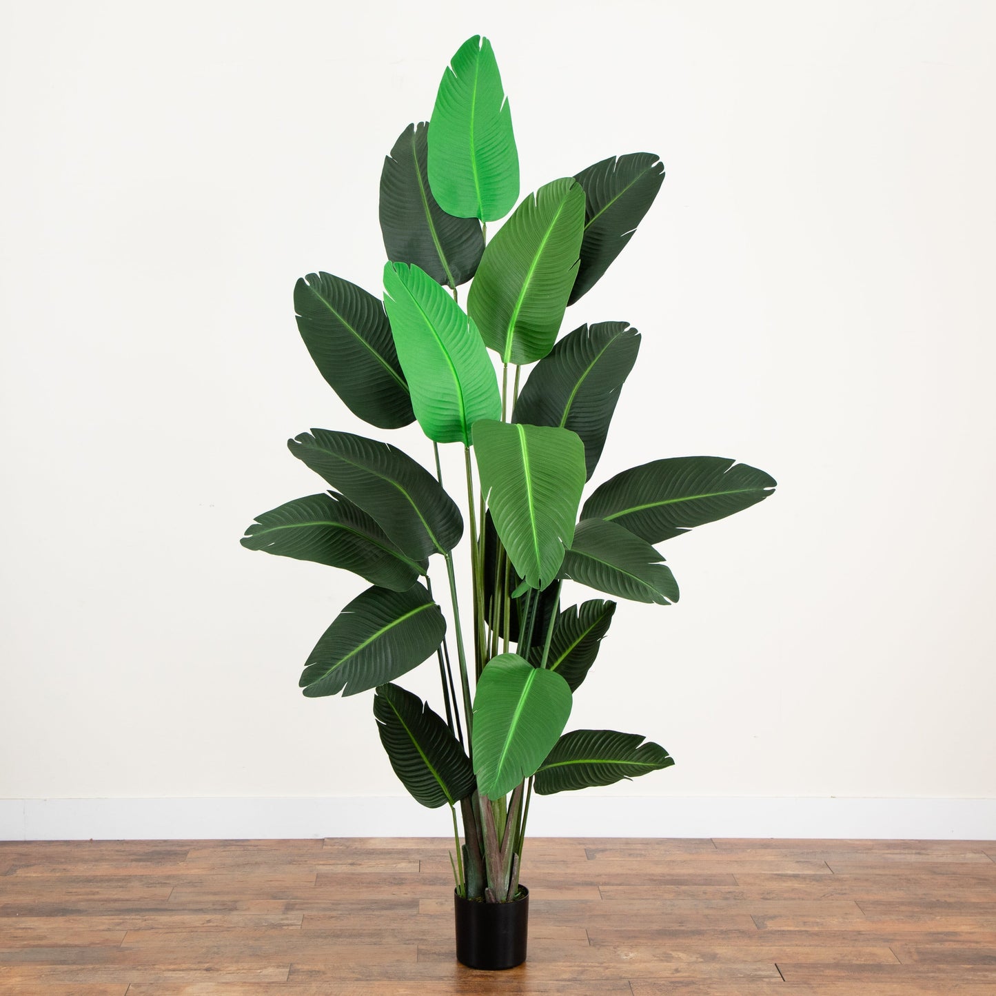 Traveler's Palm artificial indoor tree by Nearly Natural in black pot with vibrant green leaves on Tampa Home & Garden Store