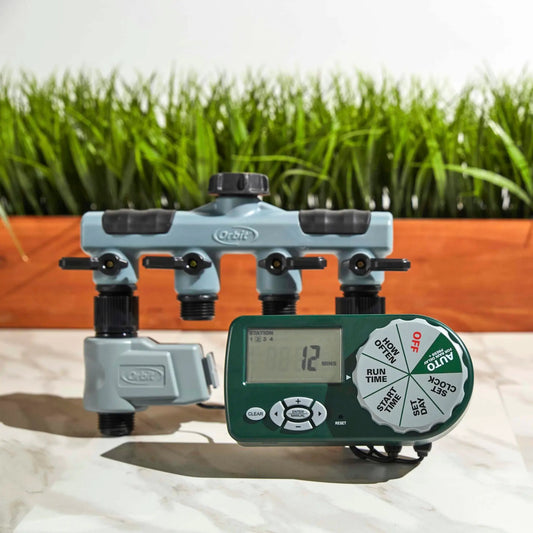 Yard watering kit with gray Orbit 4-station sprinkler manifold and controller on Tampa Home & Garden Store