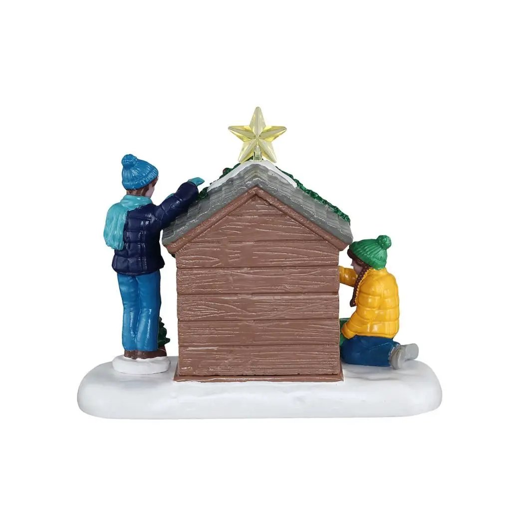 Doghouse Christmas village figurine with Jake and family, star-topped roof, snowy base on Tampa Home & Garden Store