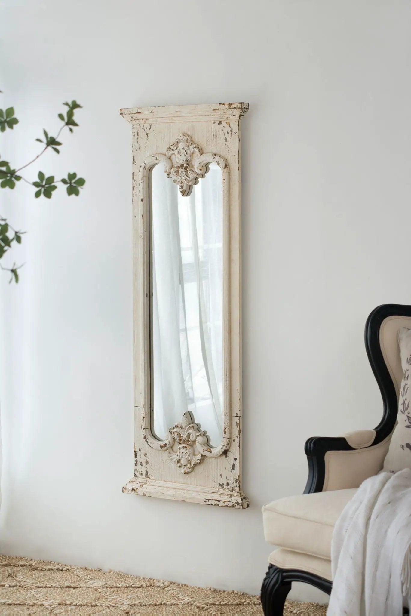 Full-length mirror with distressed white solid wood frame and ornate floral carvings on Tampa Home & Garden Store