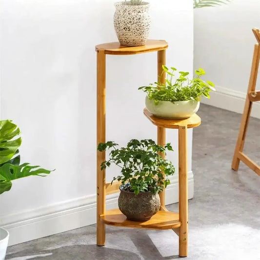 Natural bamboo three-tier plant stand by Decorbites holding three potted plants on Tampa Home & Garden Store