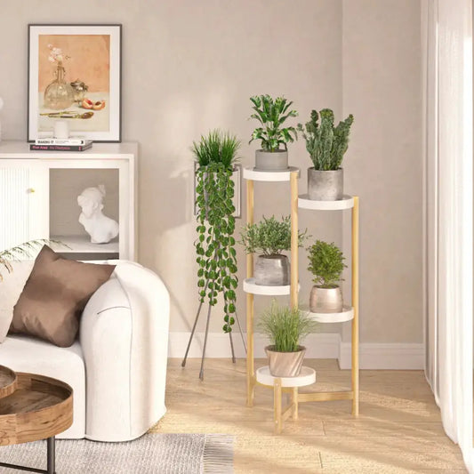 Decorbites four-tier plant stand with white shelves and gold frame in a cozy living room on Tampa Home & Garden Store