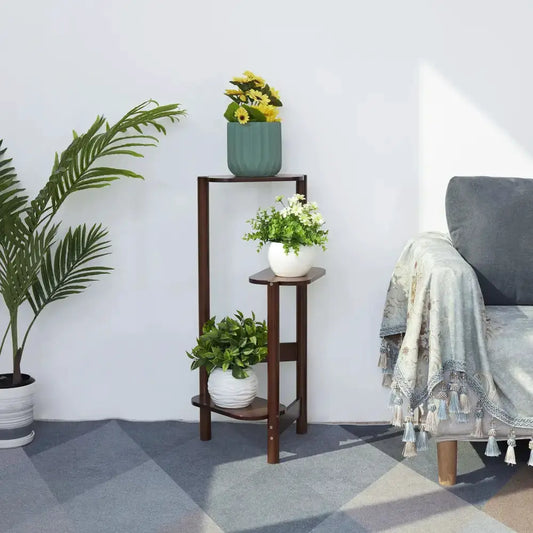 Modern dark wood bamboo 3-tier corner plant stand by Decorbites with three pots on shelves on Tampa Home & Garden Store