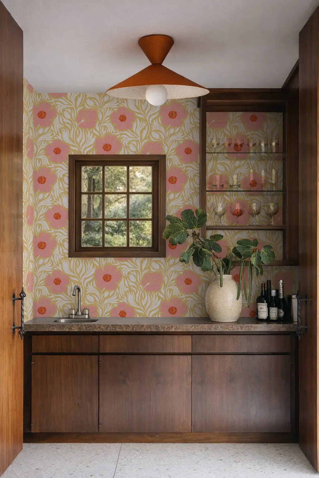 Matilija wallpaper butter yellow and pink floral pattern on wall with dark wood cabinets on Tampa Home & Garden Store