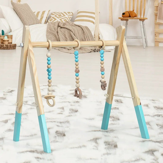 Portable wooden baby gym with three teether bead toys in turquoise and natural wood on Tampa Home & Garden Store