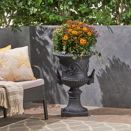 MGO Garden Urn Planter black cast-iron by HouseOfZazla with bright orange yellow purple mums on Tampa Home & Garden Store