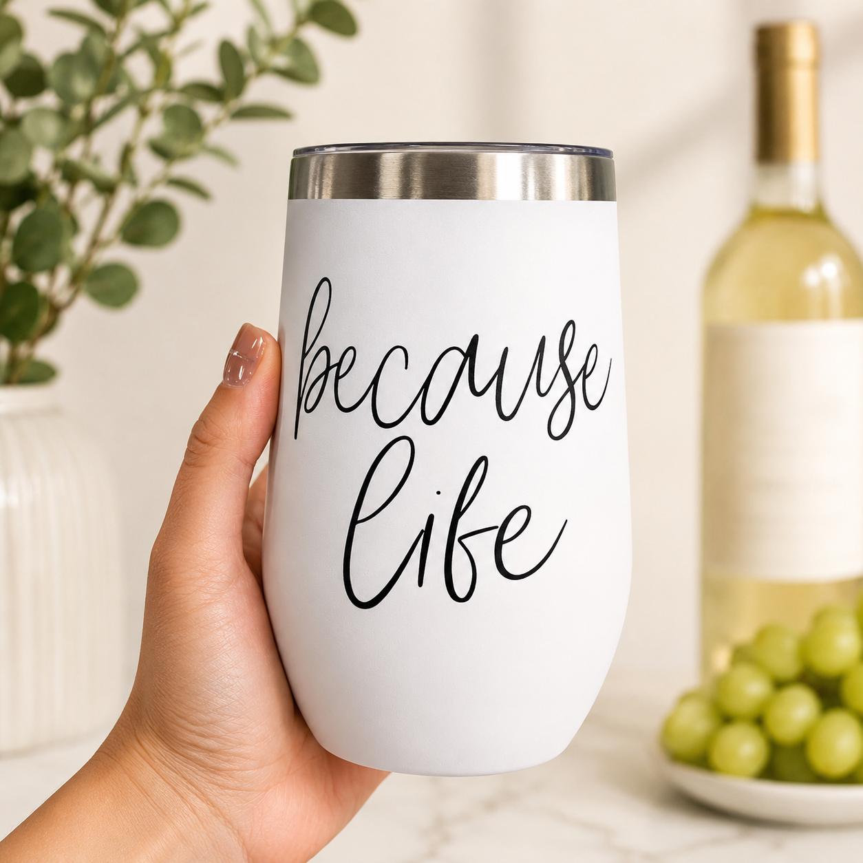 Gia Roma Because Life 17oz tumbler, white body with black script, stainless lid, handheld on Tampa Home & Garden Store