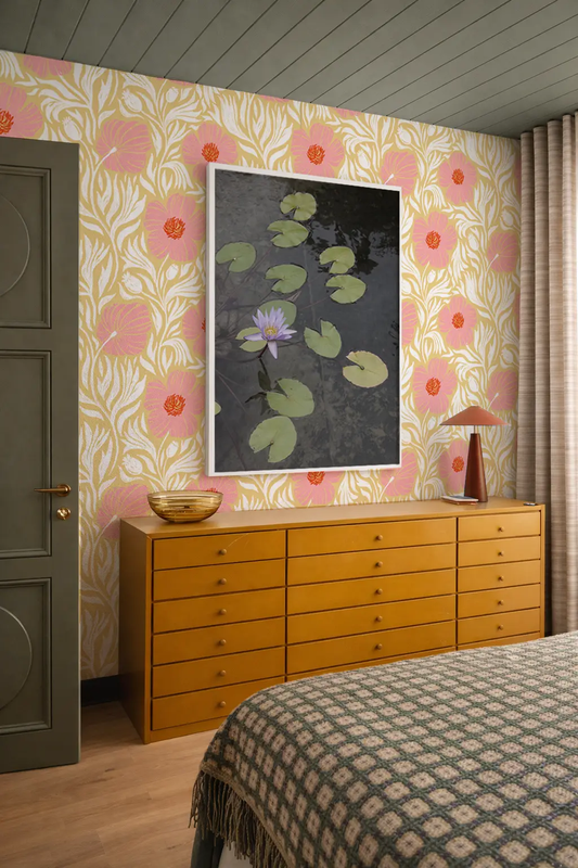 Matilija Wallpaper butter yellow and pink floral pattern on wall with mustard dresser on Tampa Home & Garden Store