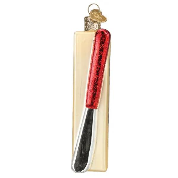 Stick of Butter Glass Ornament with gold block and red knife blade on Tampa Home & Garden Store