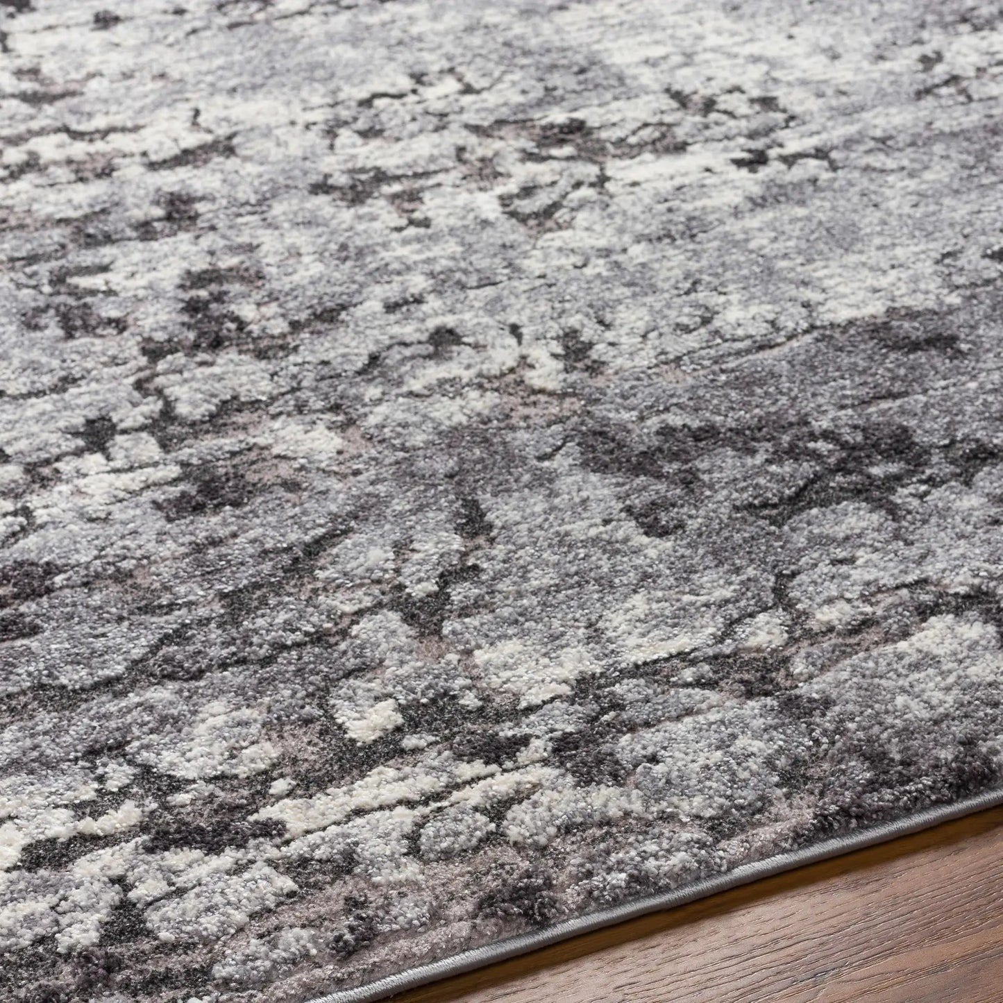 Rug Bilston Boutique Thick Luxe Charcoal with gray-white mottled pile on wood floor on Tampa Home & Garden Store