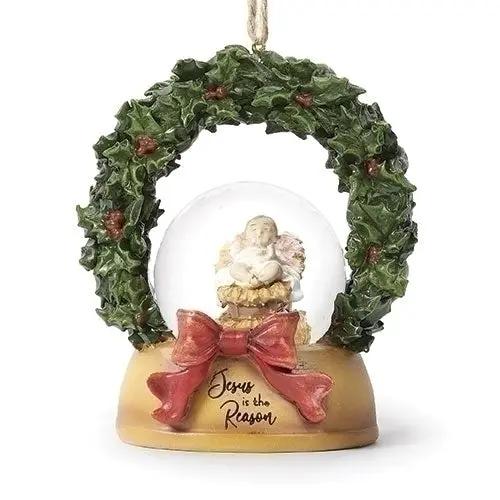 Jesus Is the Reason snowglobe ornament with angel, wreath arch, red bow on tan base on Tampa Home & Garden Store