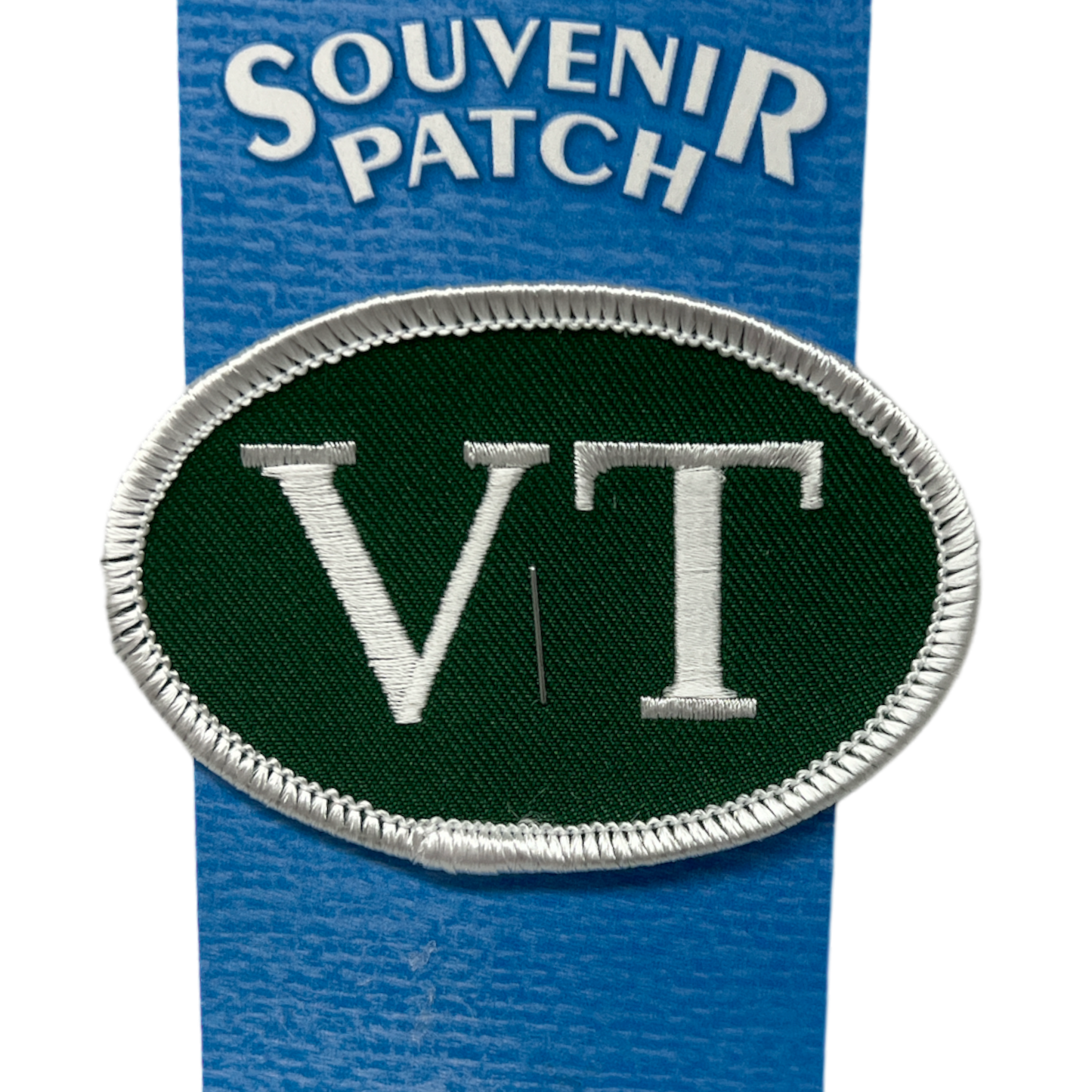 VT Souvenir Iron On Patch, green oval embroidered patch with silver border on blue backing on Tampa Home & Garden Store