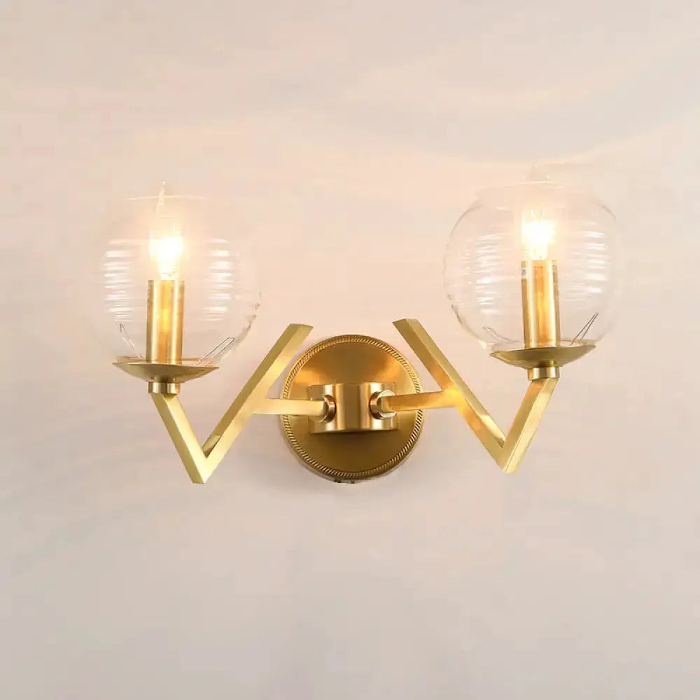 Brass double-arm ball sconce with ribbed glass shades Decorbites bedroom lighting on Tampa Home & Garden Store