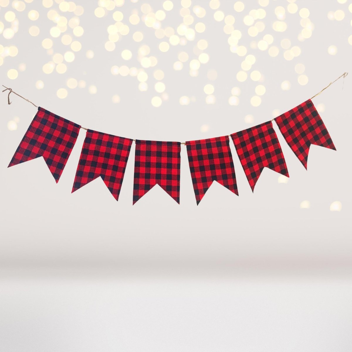Buffalo Plaid Party Banner with red-and-black check pennants on twine on Tampa Home & Garden Store