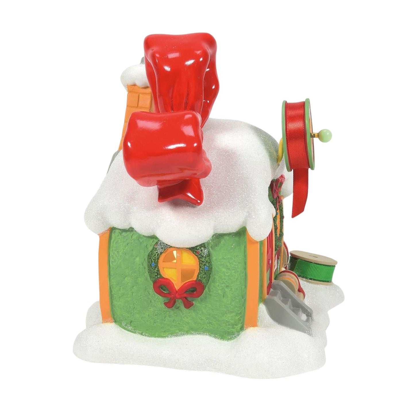 Every Whos Ribbons and Bows Grinch Village Shop snowy green storefront with red ribbons on Tampa Home & Garden Store