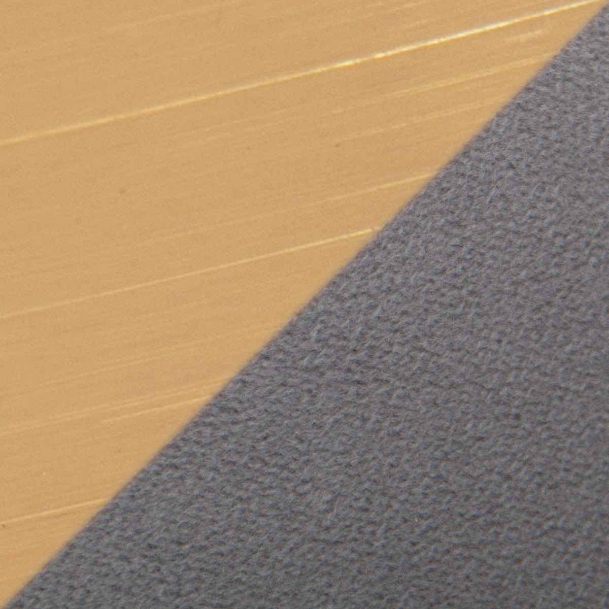 Close-up of warm wood flooring meeting blue-gray carpet at a diagonal seam on Tampa Home & Garden Store