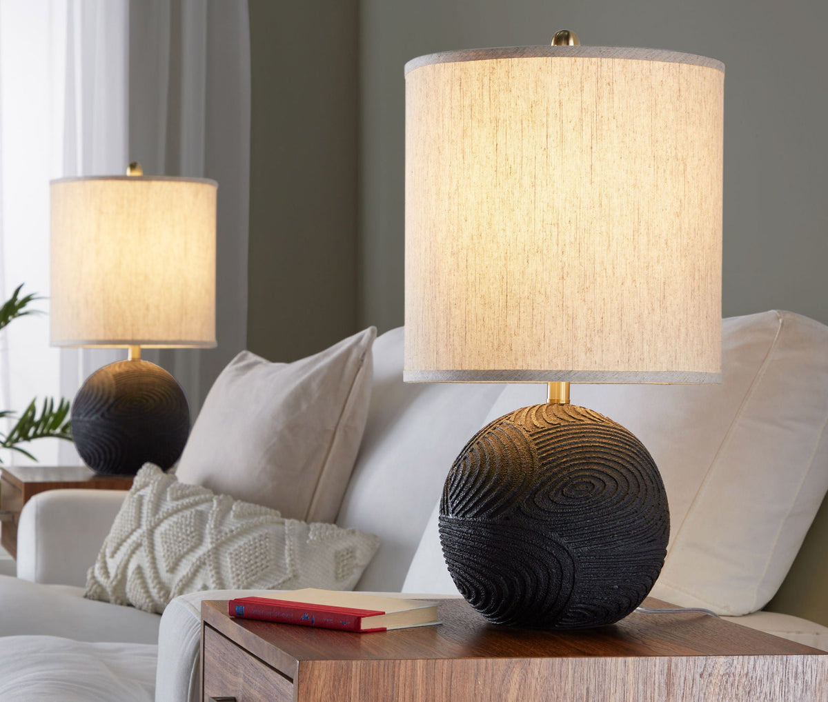 Kona contemporary lamp set (2) with matte black bases and natural linen shades on a side table on Tampa Home & Garden Store
