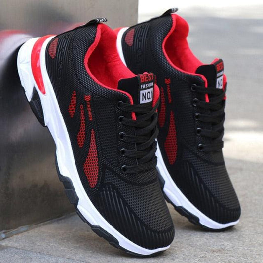 Casual sneakers pair black mesh running shoes with red accents and sole for outdoor training on Tampa Home & Garden Store
