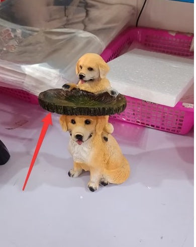 Resin garden ornament with 2 tan dog figurines under a dark circular ring, decorative backyard accent on Tampa Home & Garden Store