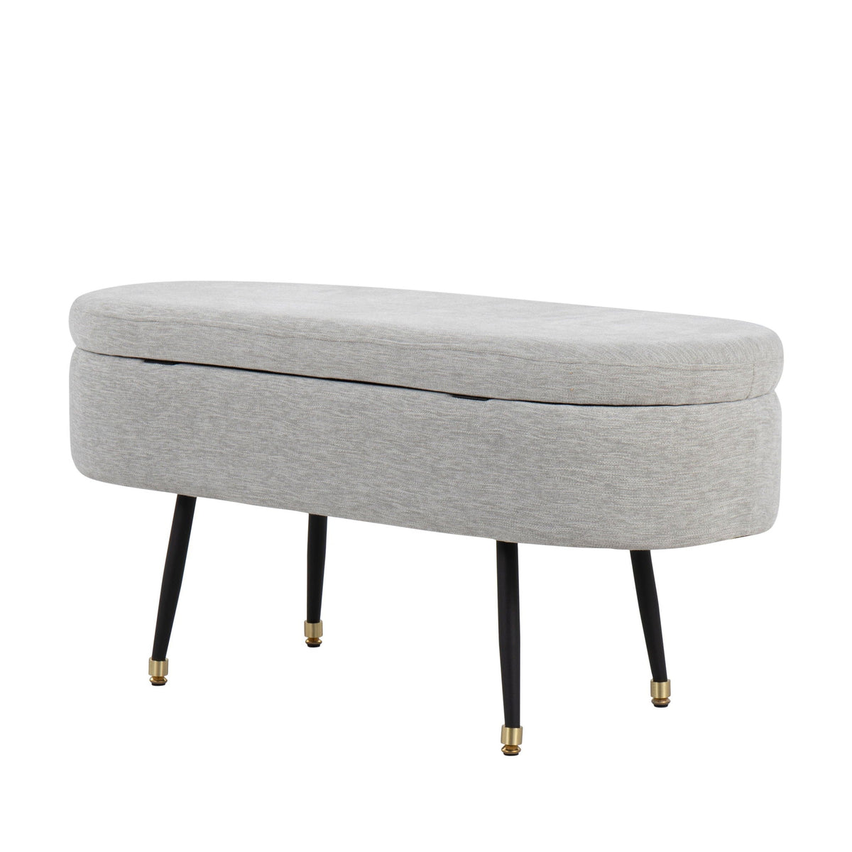 Contemporary storage bench with light gray fabric upholstery and black legs with brass caps on Tampa Home & Garden Store