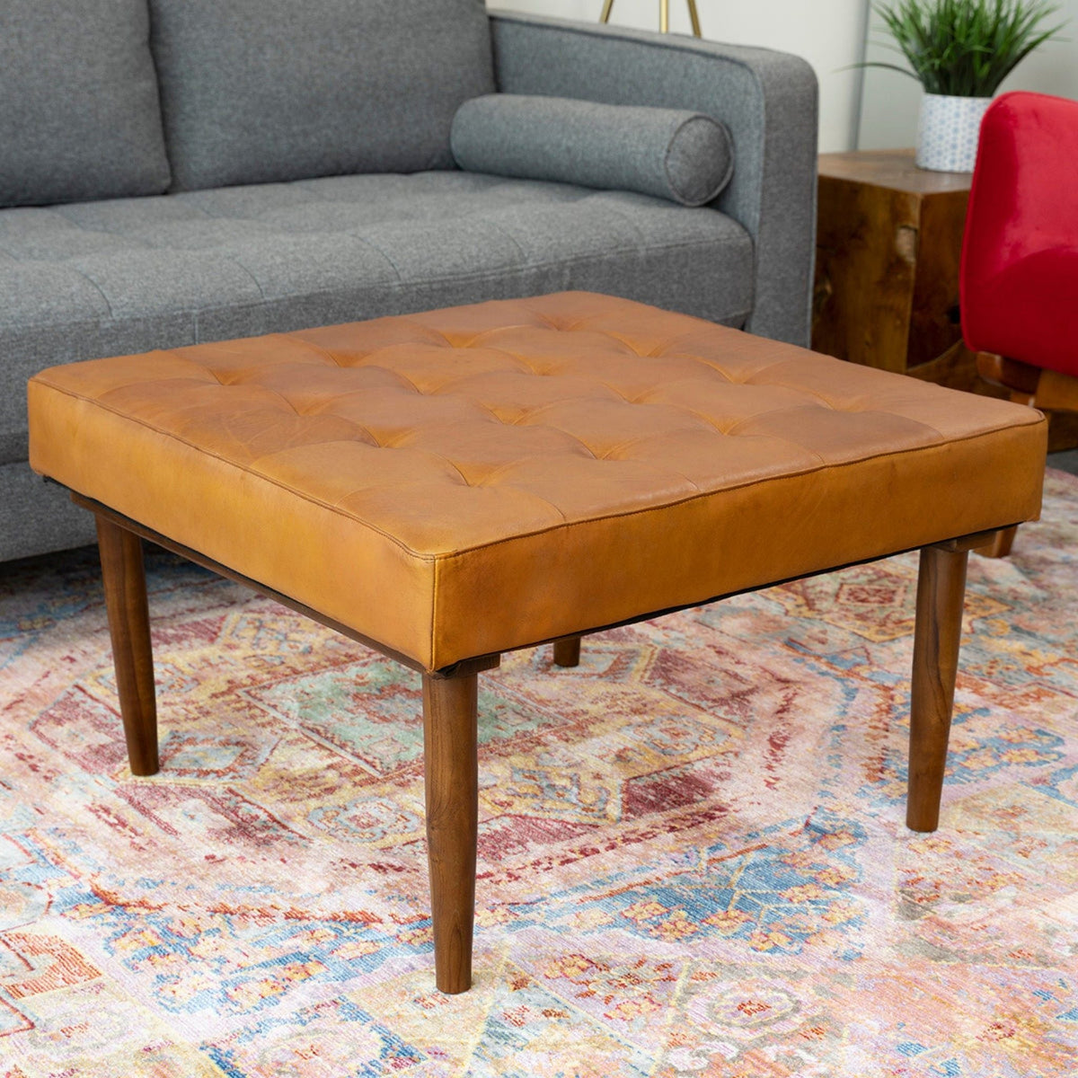 Tufted square genuine leather ottoman with high-density foam in light brown on wooden legs on Tampa Home & Garden Store