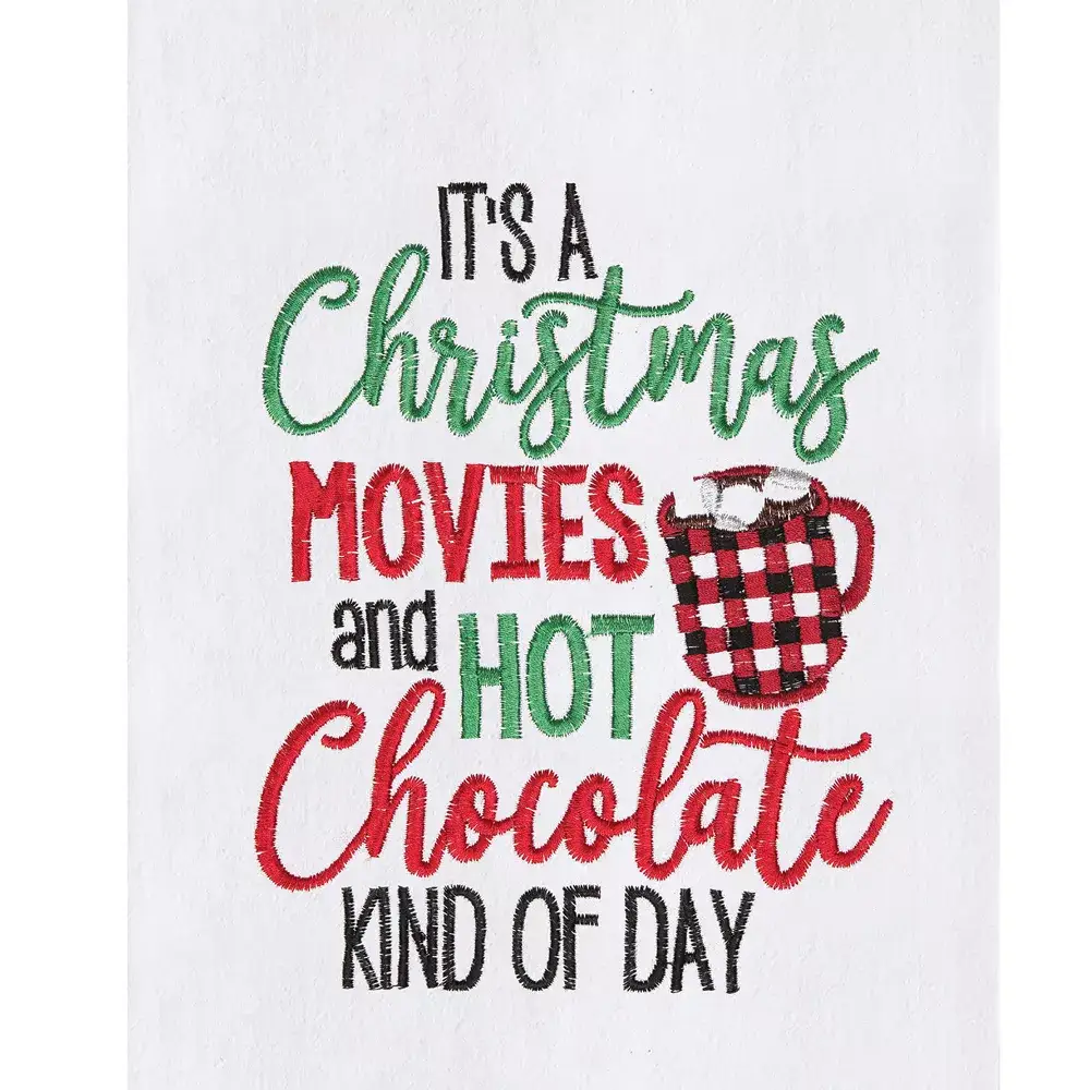 Kitchen towel with Christmas Movies design in red and green embroidery and a plaid mug on Tampa Home & Garden Store