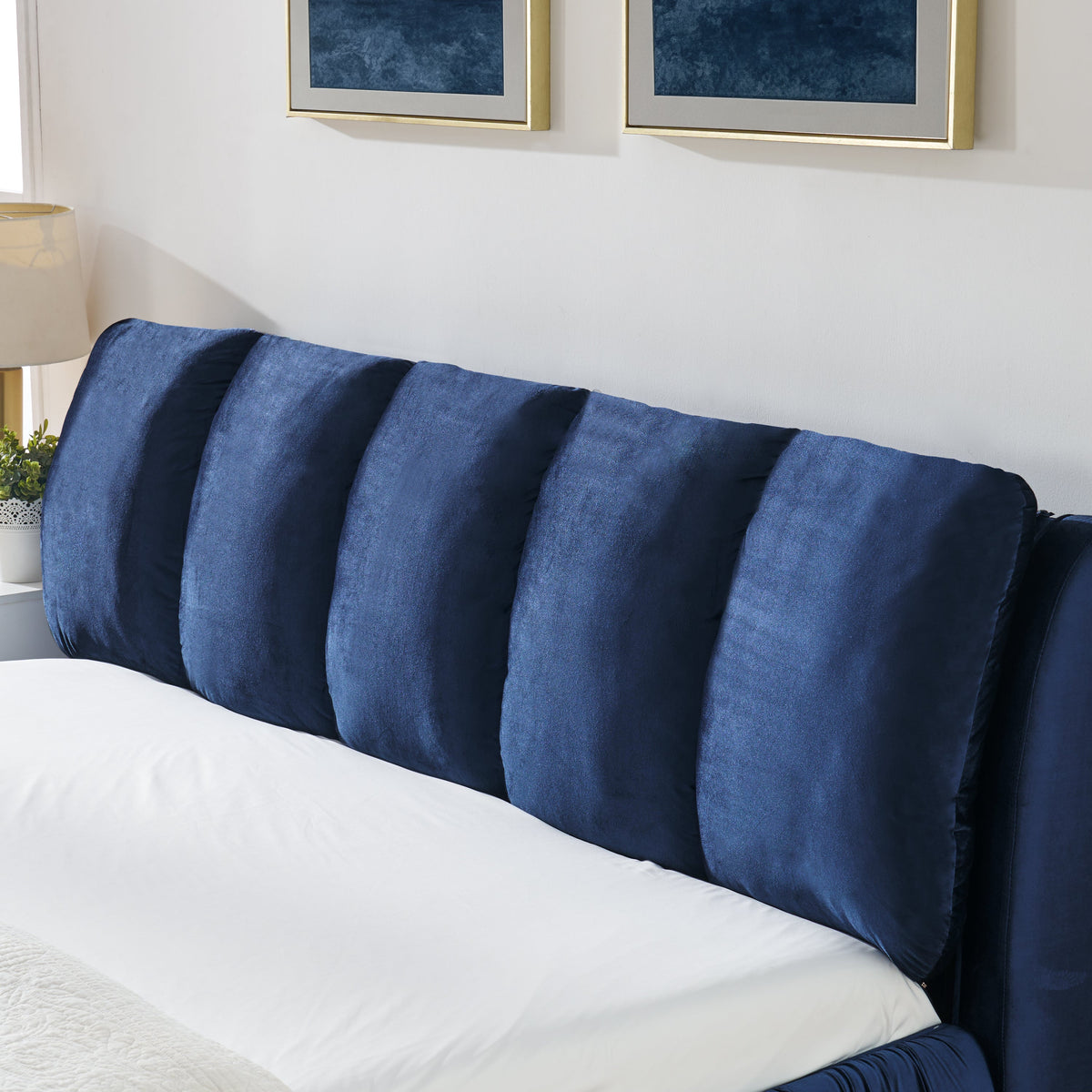 King size upholstered bed frame with segmented sponge headboard in dark blue velvet on Tampa Home & Garden Store