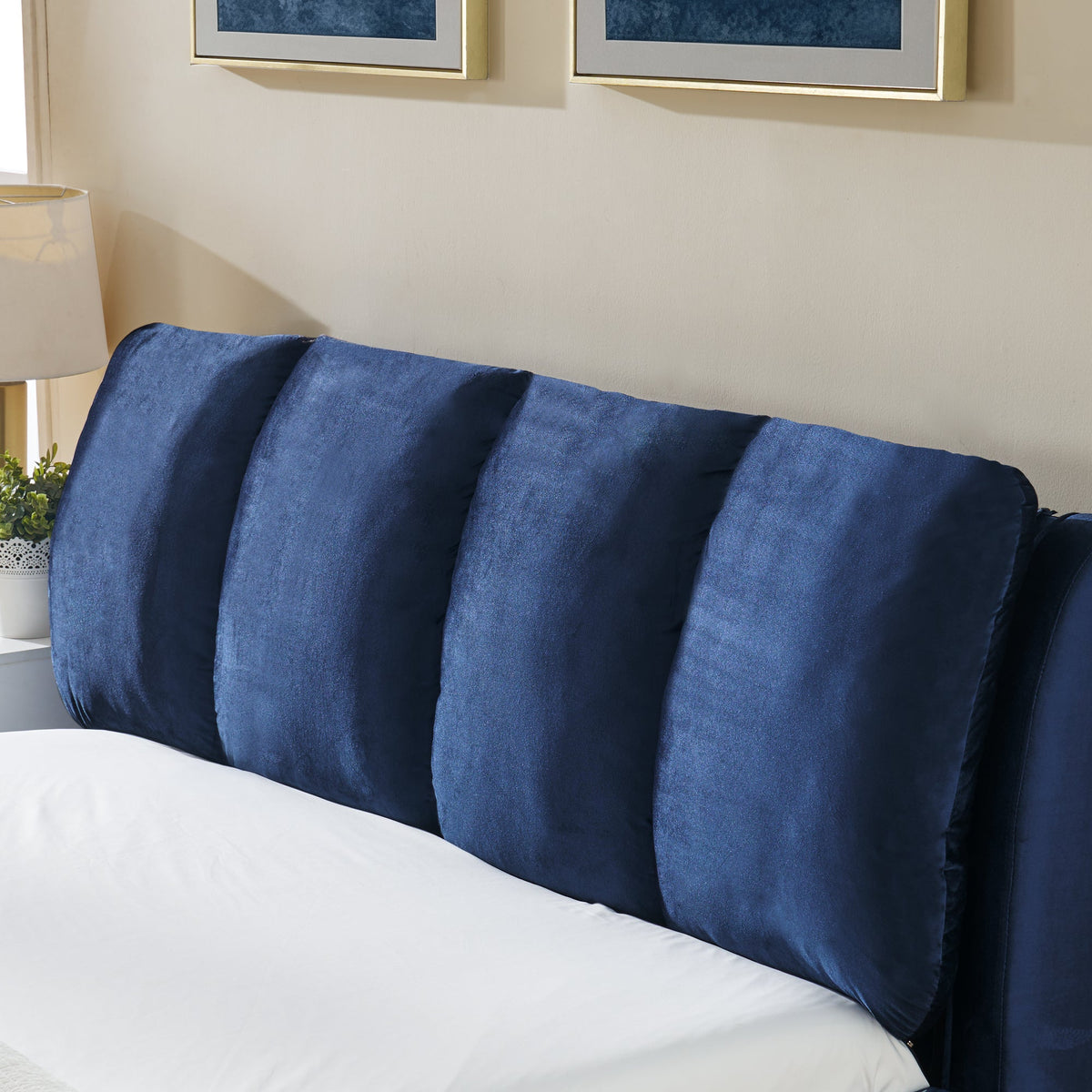 Queen upholstered bed frame with segmented dark blue velvet headboard on Tampa Home & Garden Store