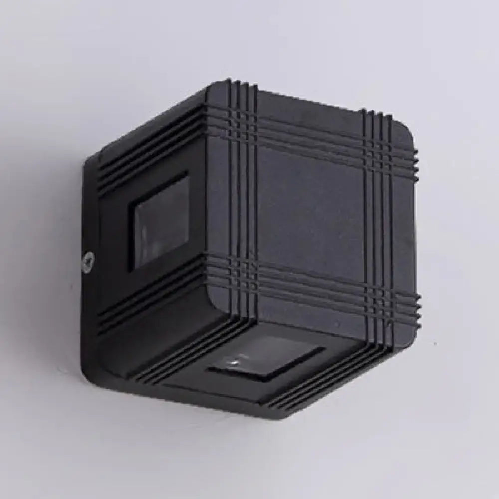 Black solar lantern sconce by Decorbites, outdoor wall light with a ribbed square design on Tampa Home & Garden Store