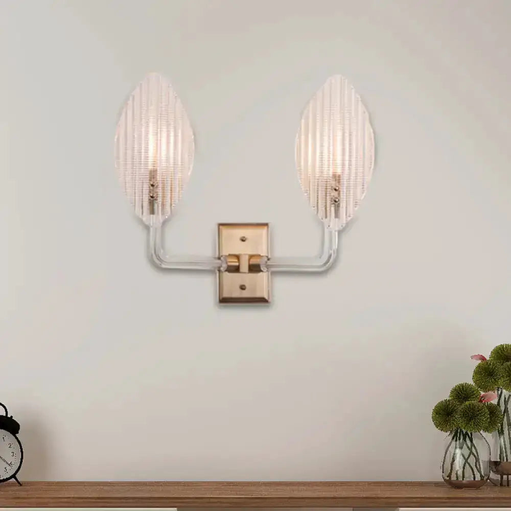 Contemporary brass leaf wall sconce with twin ribbed glass shades by Decorbites on Tampa Home & Garden Store