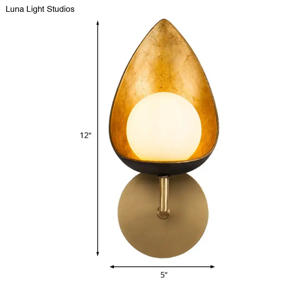 Gold Teardrop Glass Sconce by Decorbites; amber shade with glowing white globe on brass mount on Tampa Home & Garden Store