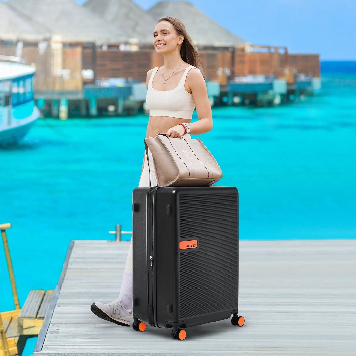 Black ABS hardshell luggage 24 inch spinner with Merax logo and orange wheels on Tampa Home & Garden Store