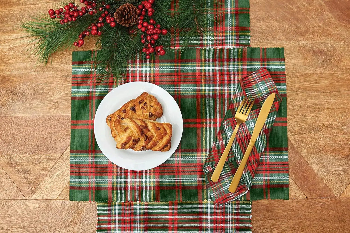 Axel Plaid Placemat green plaid with red accents under a white plate and gold cutlery on Tampa Home & Garden Store