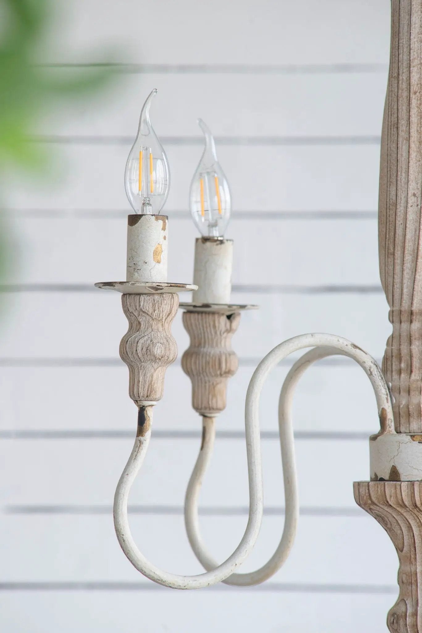 Cream white 4-light chandelier with carved wood candle holders and clear filament bulbs on Tampa Home & Garden Store