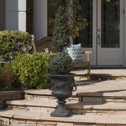 Buena Vista Urn planter in black cast iron with a tall cone-shaped topiary on Tampa Home & Garden Store