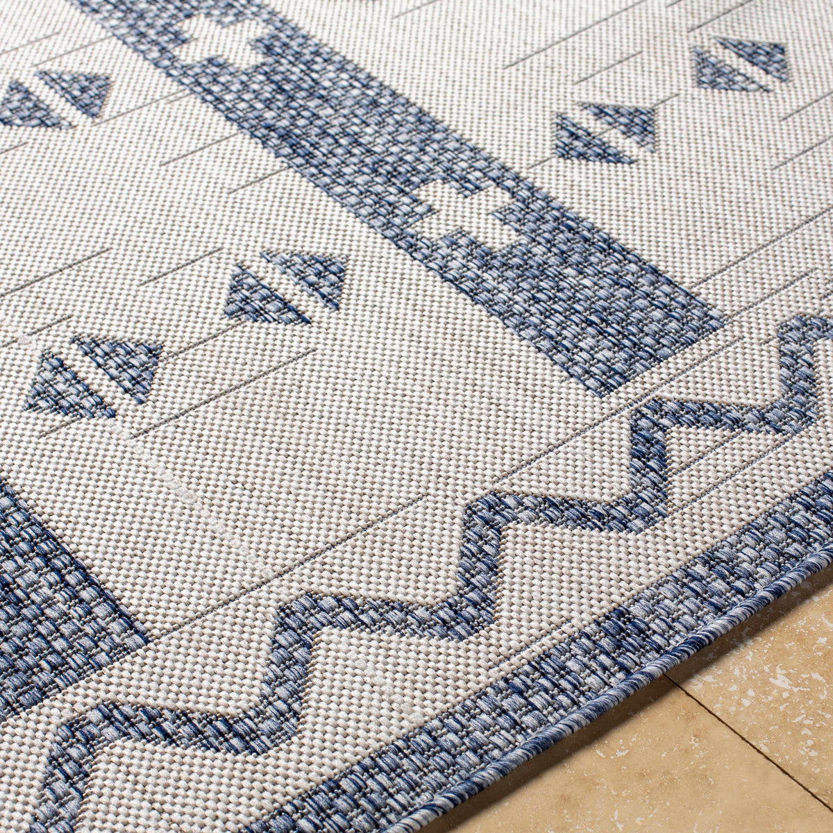 Dapitan Indoor & Outdoor Rug beige base with blue geometric motifs Boutique Rugs on Tampa Home & Garden Store