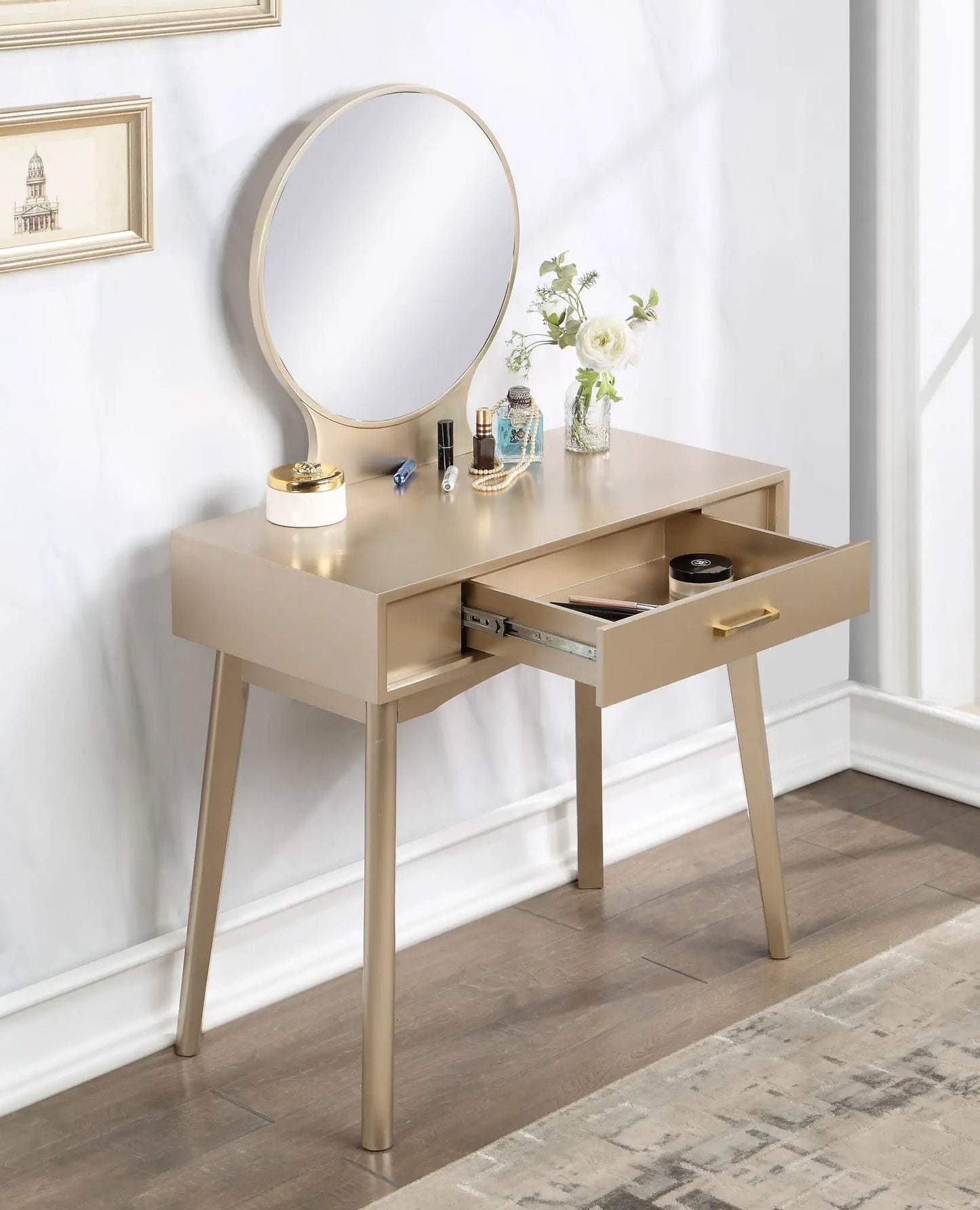 Maly contemporary gold vanity set with round mirror on a sleek wood table; makeup items on top on Tampa Home & Garden Store