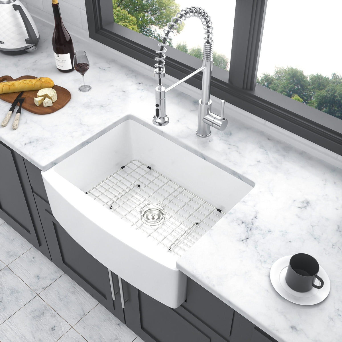 Farmhouse apron-front single-bowl sink with arch edge by HouseOfZazla; chrome faucet on Tampa Home & Garden Store