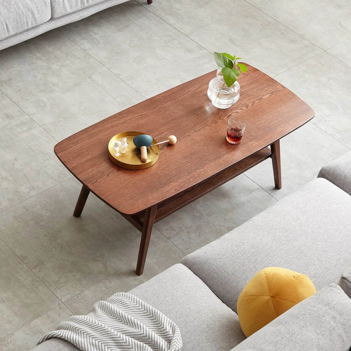 Low coffee table with storage shelf in warm wood finish by Unique Piece Furniture, modern legs on Tampa Home & Garden Store