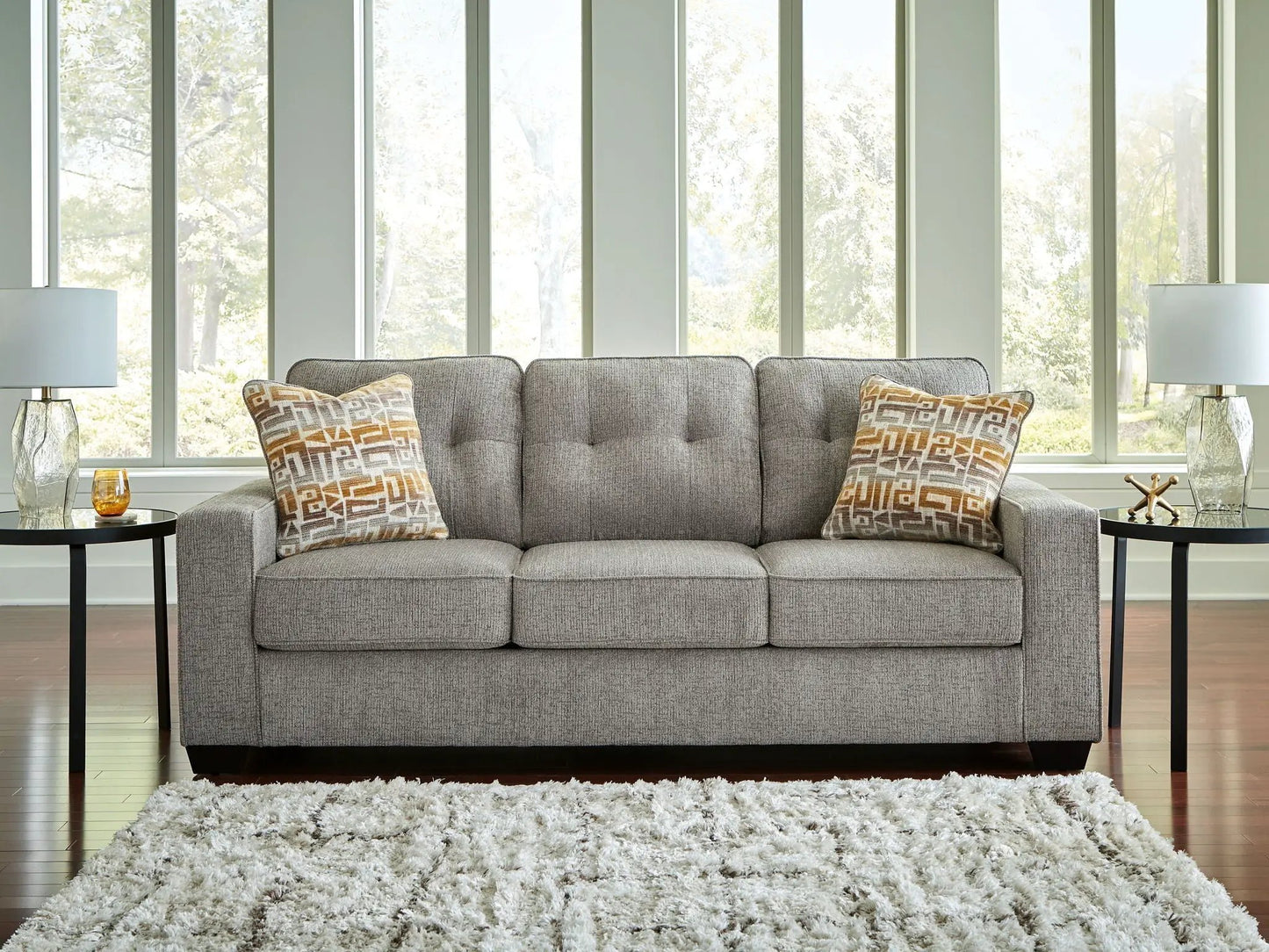 Larimer sofa by Unique Piece Furniture, gray fabric stationary sofa with two pillows on Tampa Home & Garden Store