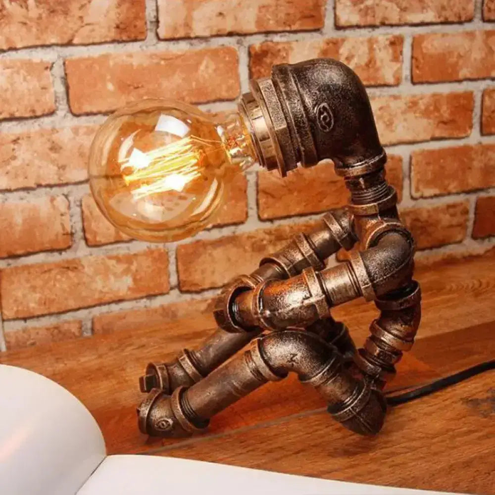 Industrial Robot Table Lamp Antiqued Bronze Metal with pipe-style body and Edison bulb on Tampa Home & Garden Store