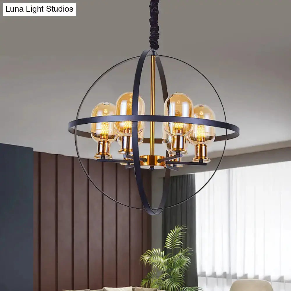 Industrial amber glass pendant chandelier with brass finish and circular orb frame on Tampa Home & Garden Store