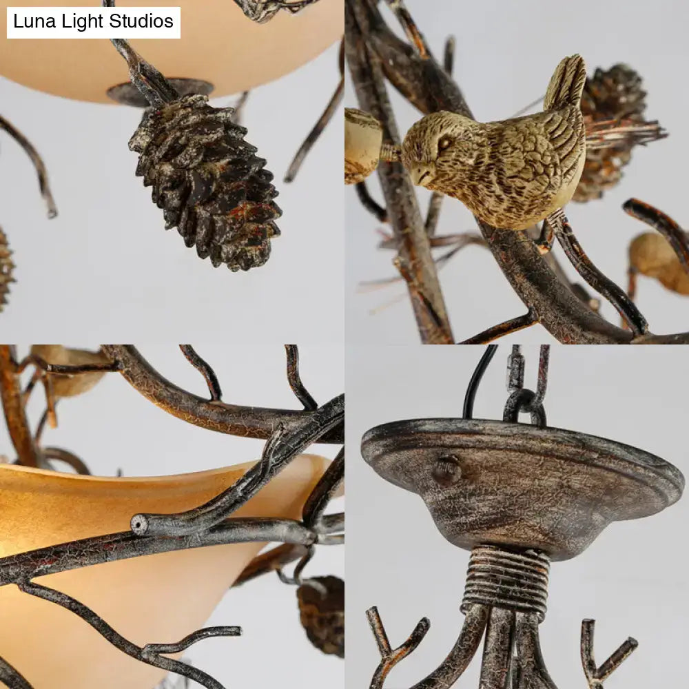 Bronze Bird Branch Light fixture by Decorbites with pinecone accents and twig detailing on Tampa Home & Garden Store