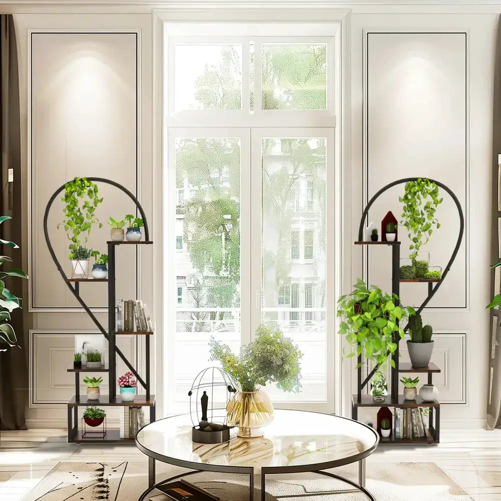 Pair of black and wood heart-shaped 6-tier plant stands with arches and plants on Tampa Home & Garden Store