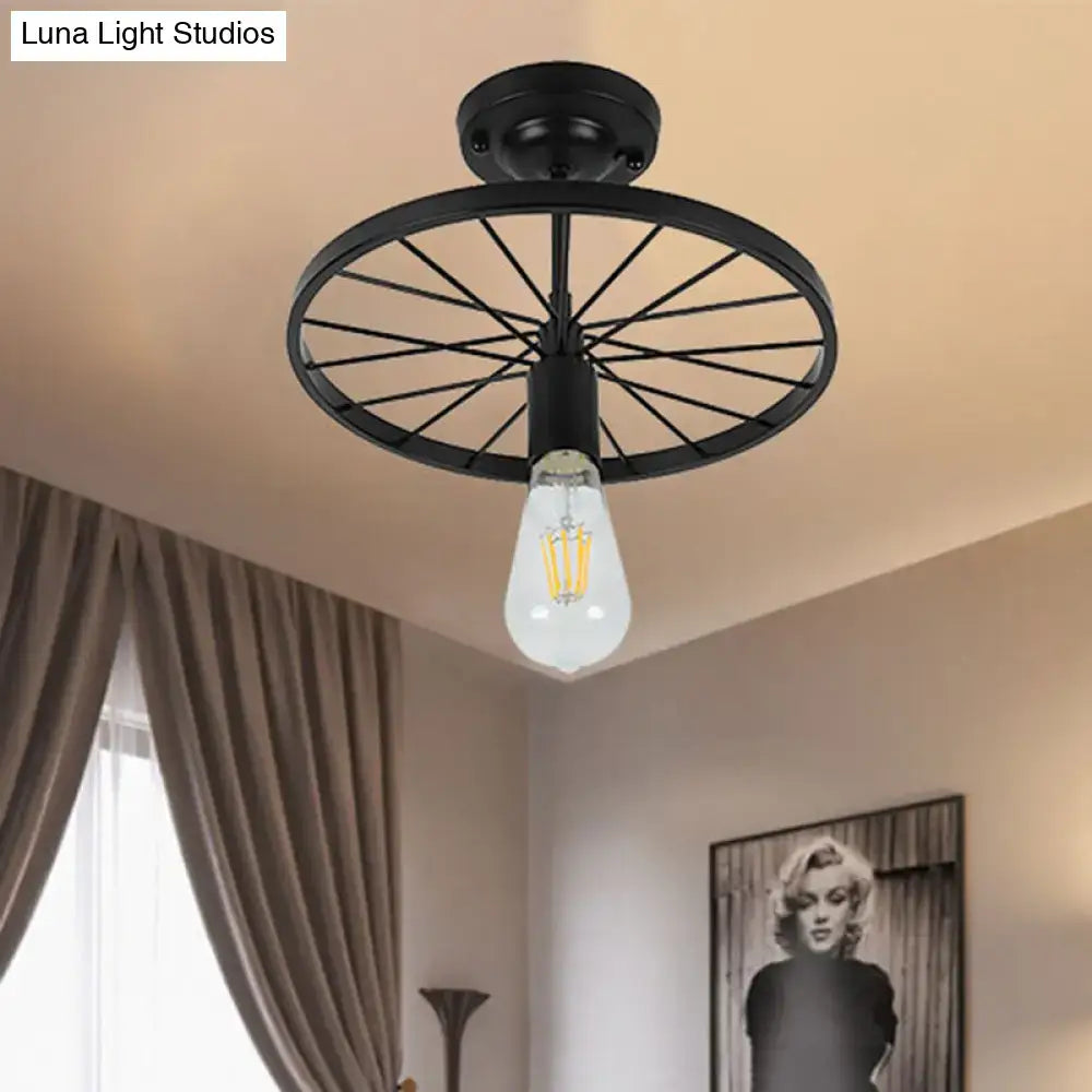 Black Wheel Ceiling Light with metal wheel frame and Edison bulb, flush-mount fixture on Tampa Home & Garden Store