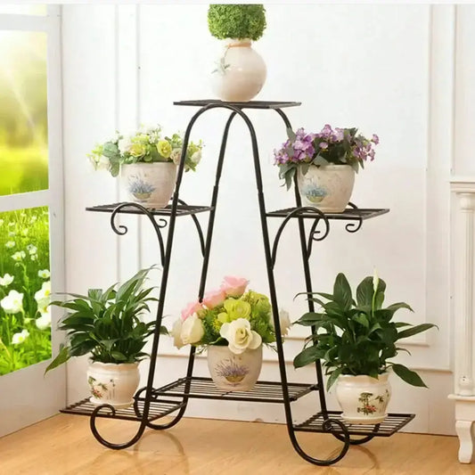 Decorbites ornate black metal plant stand 6-tier with potted plants on each shelf on Tampa Home & Garden Store