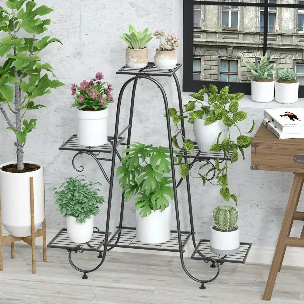 Ornate black metal plant stand 6-tier display by Decorbites with multiple potted plants on Tampa Home & Garden Store